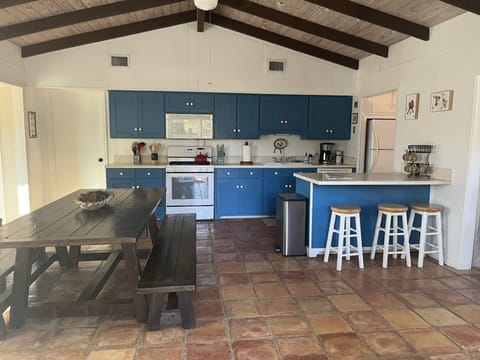 Open kitchen and wood-burning fireplace.