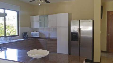 Fridge, cookware/dishes/utensils, dining tables