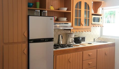 Fridge, cookware/dishes/utensils, dining tables