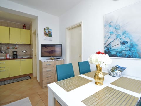 Furniture, Property, Table, Cabinetry, Plant, Interior Design, Flooring, Floor, Flower, Yellow