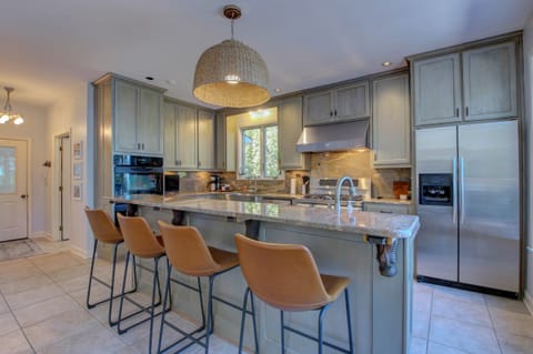 Chefs kitchen with island seating