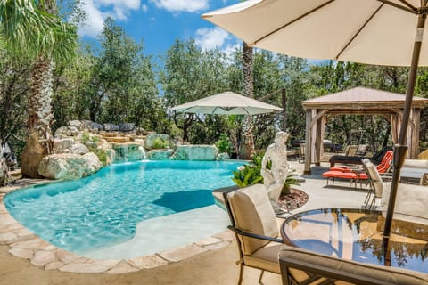 Large Pool Deck with multiple seating and dining options with 2 dining tables.