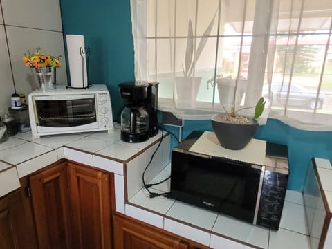 Fridge, microwave, stovetop, coffee/tea maker