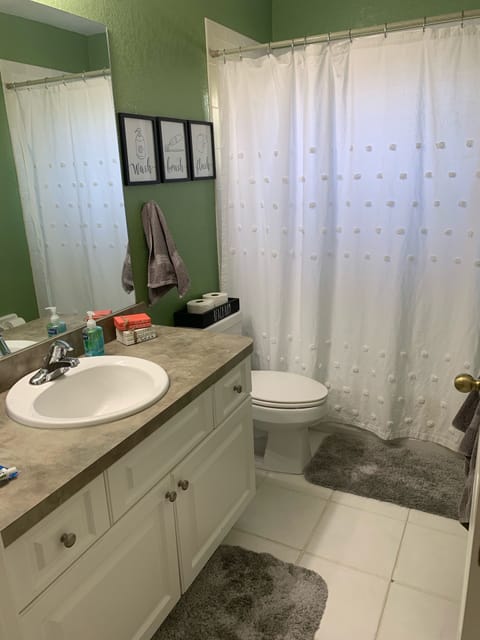 Combined shower/tub, hair dryer, towels, soap