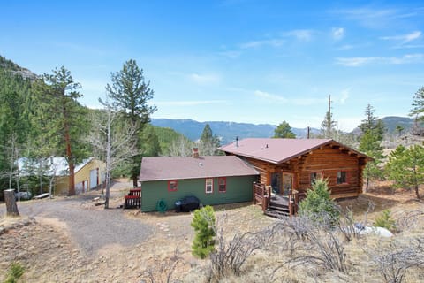 Idyllic setting for a cozy cabin on a ridge overlooking the mountains.