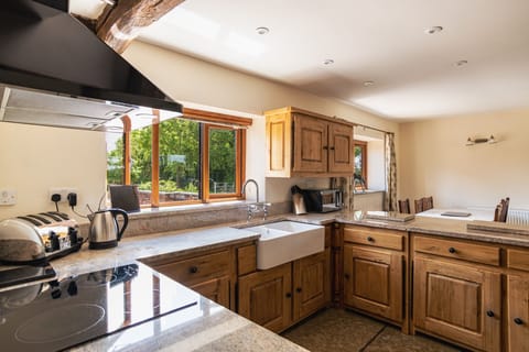 Oak kitchen cupboards with an under counted fridge & separate freezer