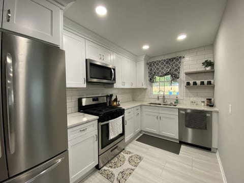 Fridge, stovetop, dishwasher, dining tables