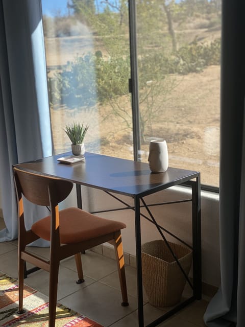 desk in master bedroom with view of the mountains