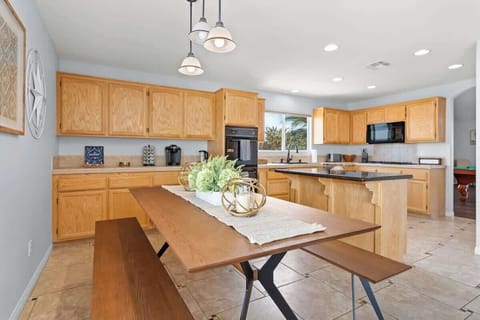 Our kitchen has modern stainless steel appliances for your group's chefs. You can also relish your meals at the 6-seater dining table.