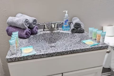 Combined shower/tub, hair dryer, towels, soap