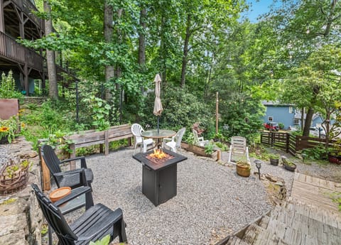 Apartments backyard. Fire table (gas) and dining table with umbrella for guests.