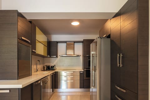 The modern kitchen, fully equipped with branded appliances and equipment