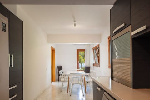 The first house has a casual dining area within the kitchen for 6.