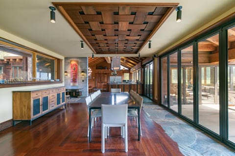Dining area (seats 10). Note unique "woven redwood" ceiling feature