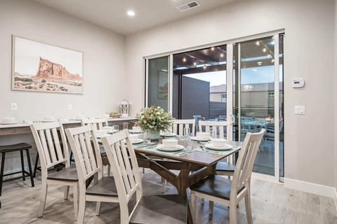 Open concept dining area with dining table for 8 plus 8 stools