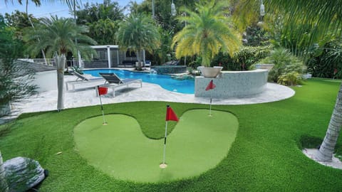 BBQ area, plenty of comfortable lounge chairs, and a fun mini-golf course!