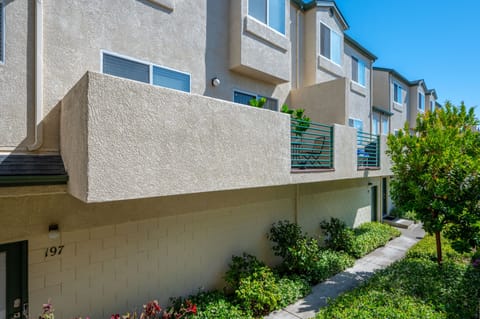 Balcony with BBQ and bistro table on 2nd floor of condo
