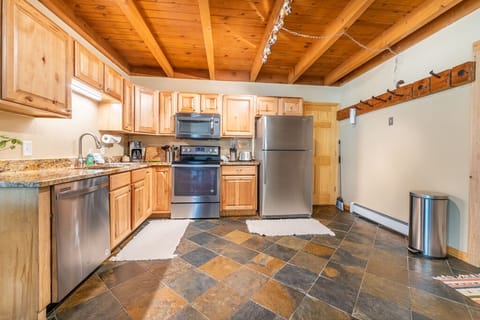 Updated full size kitchen with granite countertops and stainless steel appliances.