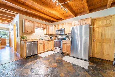Updated full size kitchen with granite countertops and stainless steel appliances.