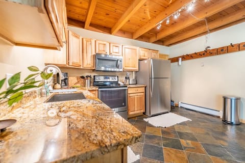 Updated full size kitchen with granite countertops and stainless steel appliances.