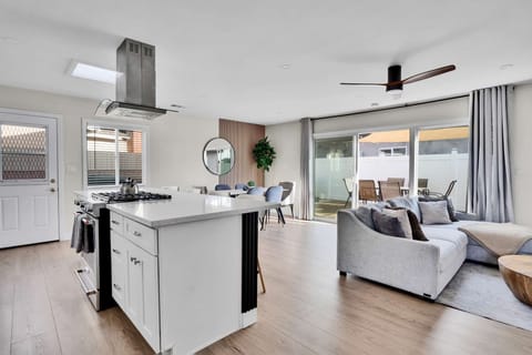 Open-concept living area with seamless flow from kitchen to dining area.