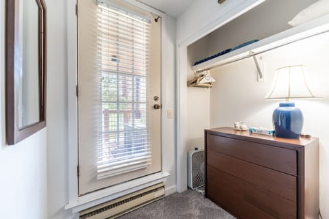 Guest bedroom has access to outside.