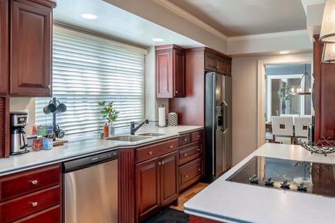 Kitchen with island and electric stove top