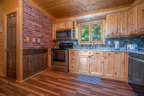 Kitchen is outfitted with an electric range