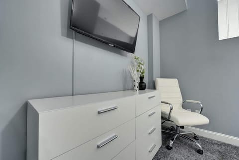 The TV in the bedroom offers the perfect spot to unwind and enjoy your favorite shows. Whether you're relaxing before bed or spending a lazy afternoon, the added convenience of in-room entertainment makes your stay even more enjoyable.