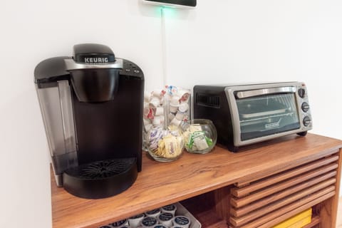 Keurig with KCups, creamers, sugar, etc.
