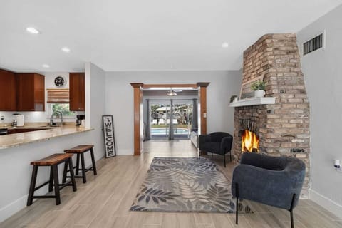 View from entry way of seating area and kitchen.