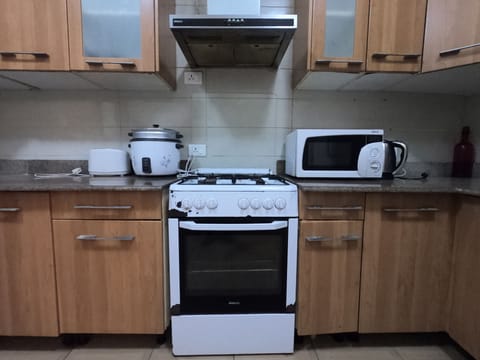 Fridge, microwave, cookware/dishes/utensils