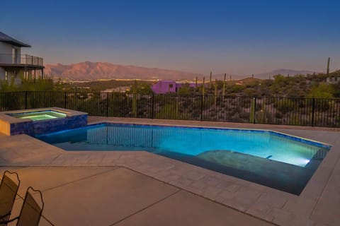Backyard pool with hot tub and views of the Catalina Mountains