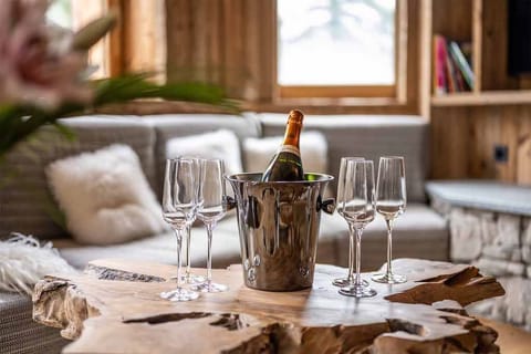 Enjoy a glass of wine on the cozy sofa.