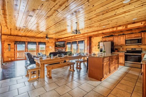 【Expansive Living + Dining Area】Large dining table accommodates all your guests with additional seating in the living area