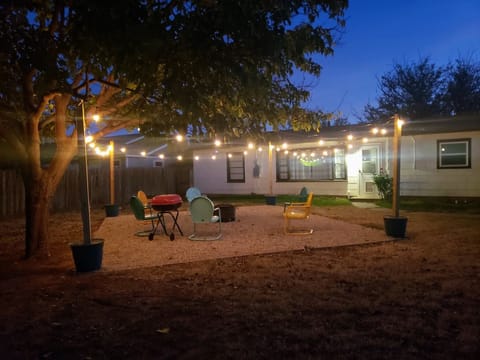 Great hangout space out back with firepit, charcoal grill, games and lights.