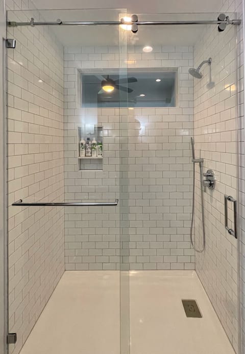 Spacious tiled shower. Body wash, shampoo and conditioner provided.