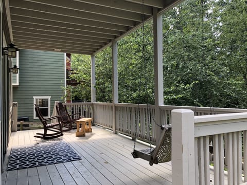 Your private porch overlooks a verdant ravine where you can swing or rock.