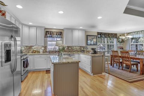 Large kitchen, with all the cooking and eating utensils you need. 
