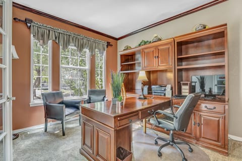 Work from this private office with french doors. 