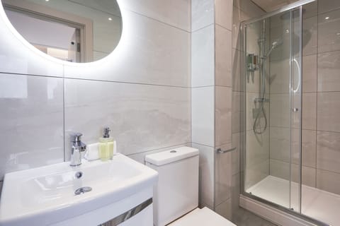 Combined shower/tub, hair dryer, towels, soap