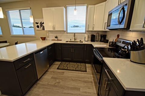 Kitchen with large, farm sink. Beautiful views of the Grand Mesa/Mount Garfield.