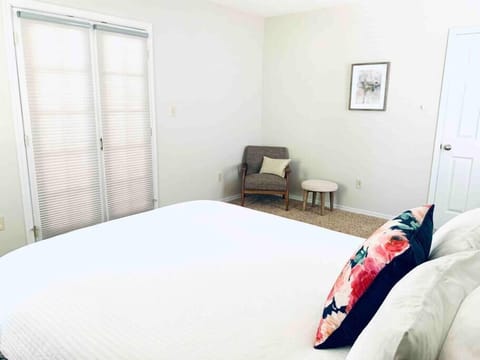 Grand first floor bedroom with private French doors (privacy shades recently added, 2019). Bedroom is furnished with new bed frame and queen plush mattress. 