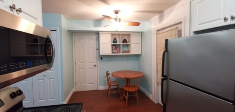 dining area, microwave, oven and refrigerator, that door going to the laundry