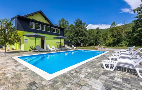 A heated pool, sun loungers