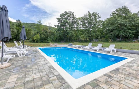 A heated pool, sun loungers