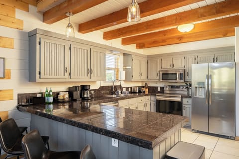 Chef's Kitchen - Fully equipped with modern appliances, cookware, and thoughtful extras, the kitchen makes it easy to prepare meals while staying part of the conversation.