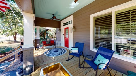 Plenty of seating with ceiling fans on this grand porch.