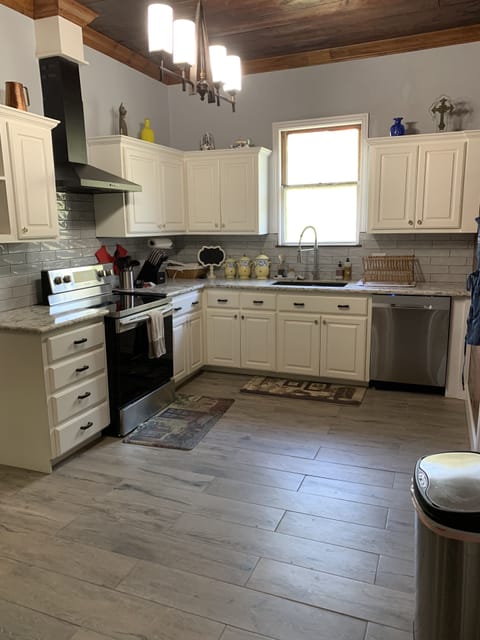 Kitchen view with stove and dishwasher.