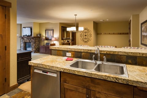 Kitchen and bar area. Fully stocked with cookware and dishware.